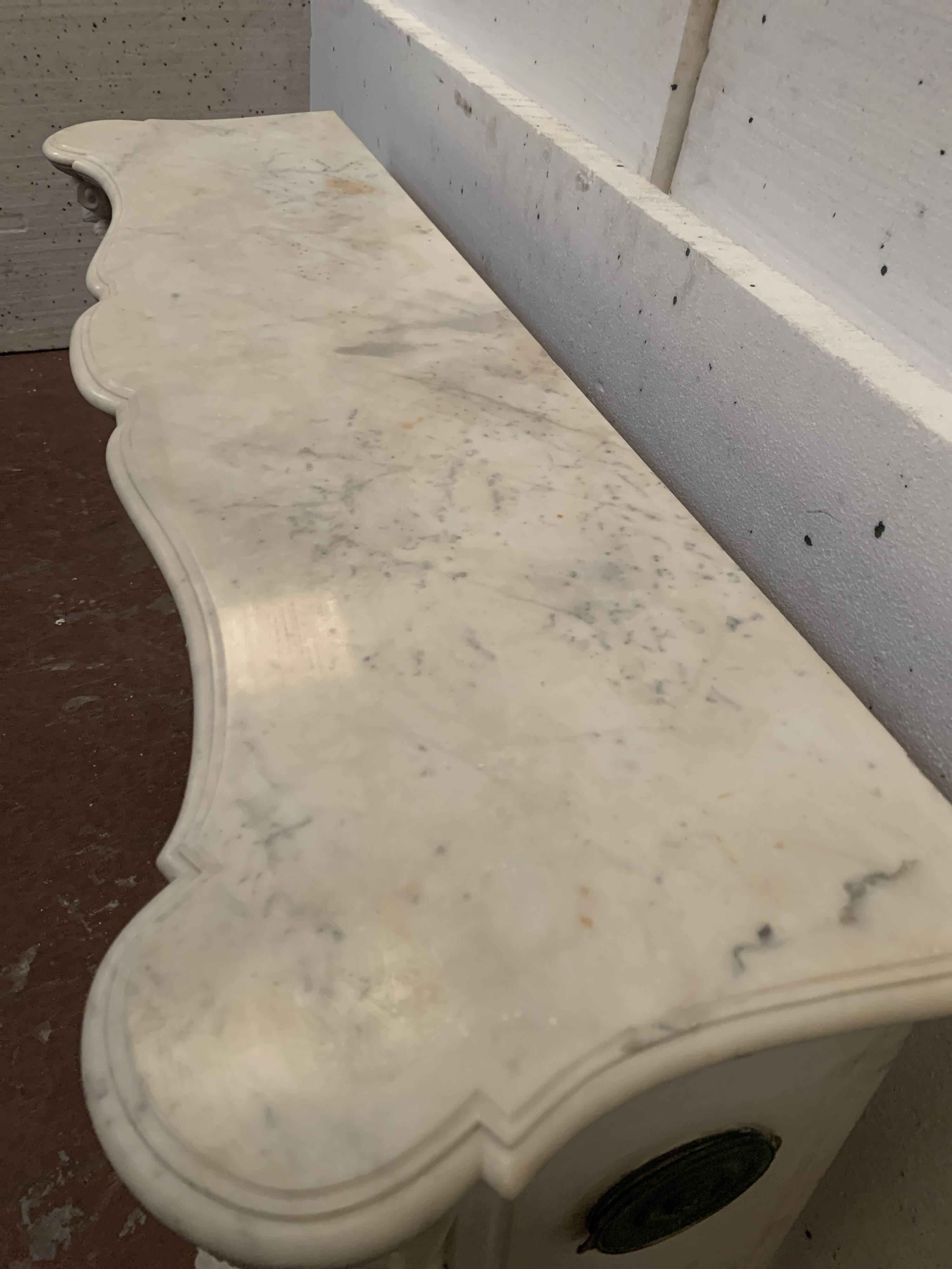 Louis XV style fireplace in white Carrara marble, 19th century