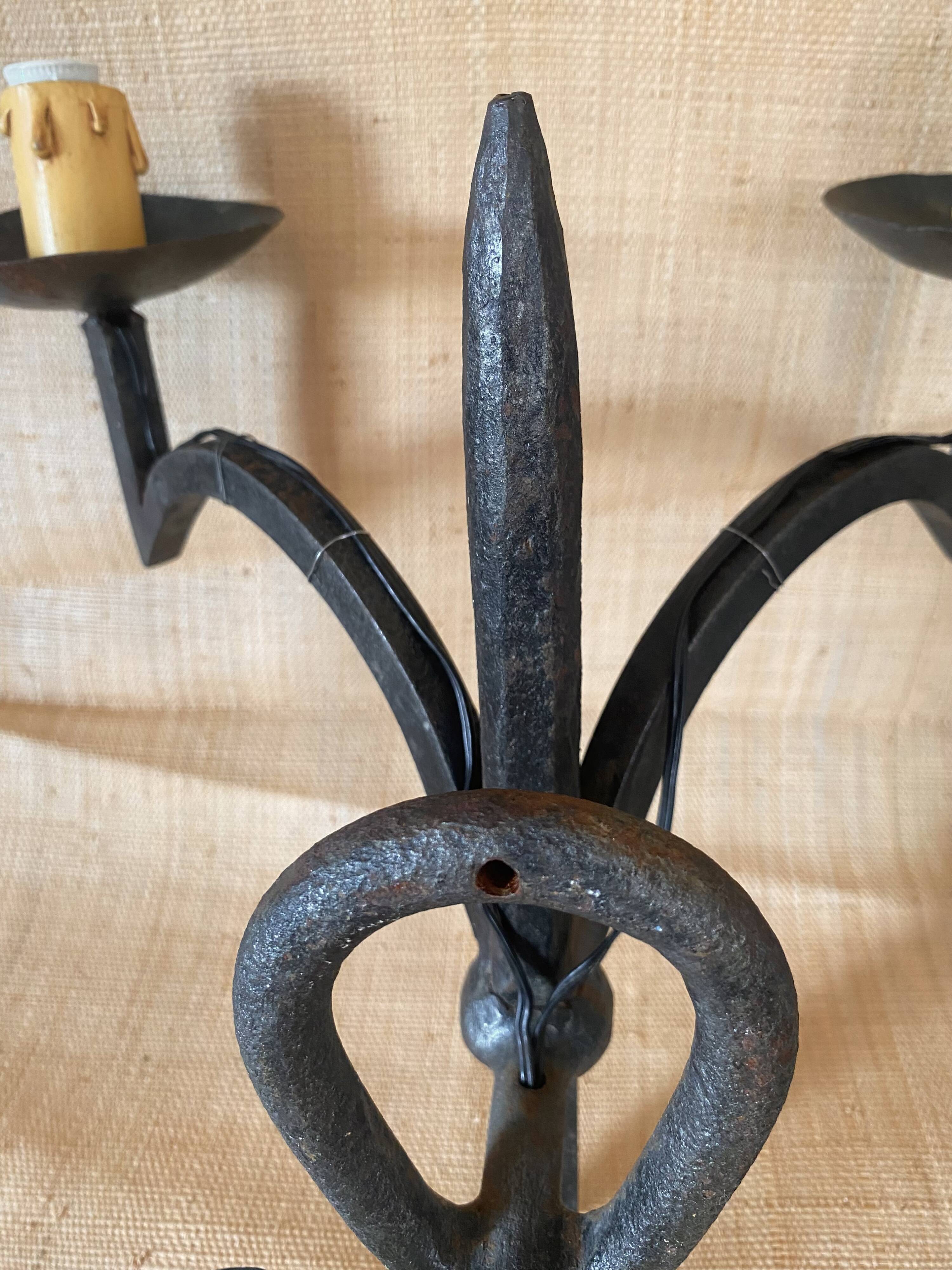 Wrought iron wall lights.