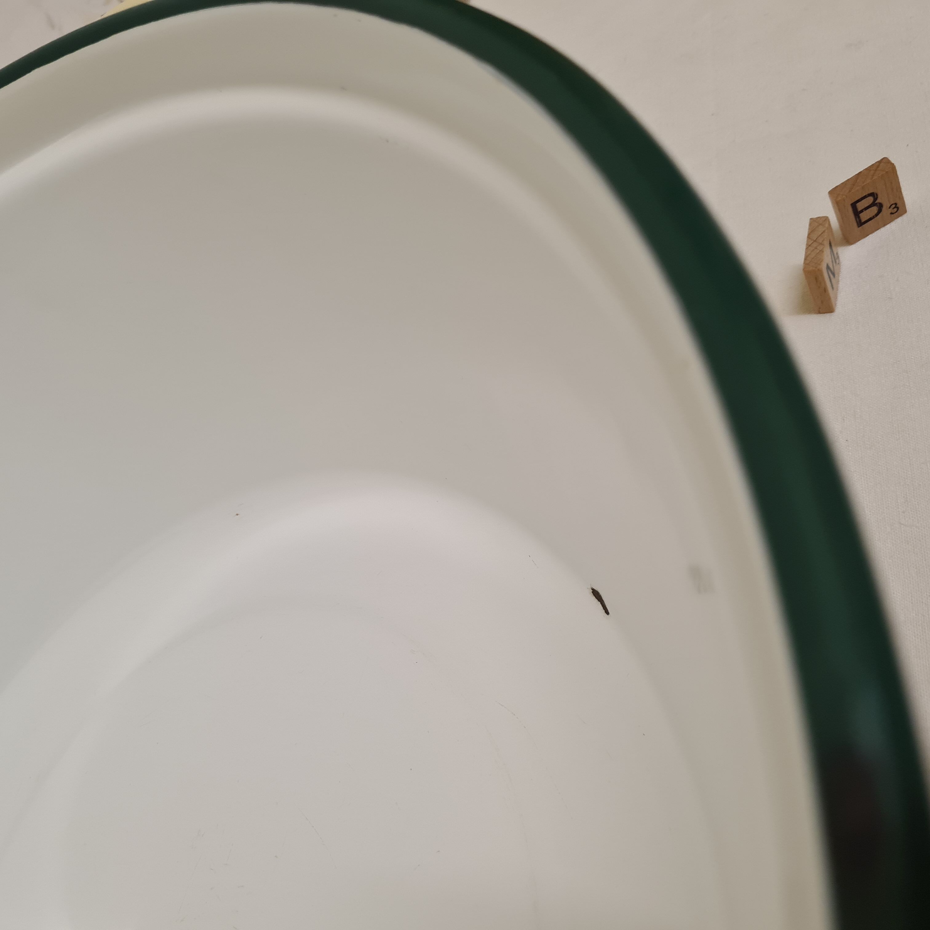 Yellow enamelled sheet metal basin