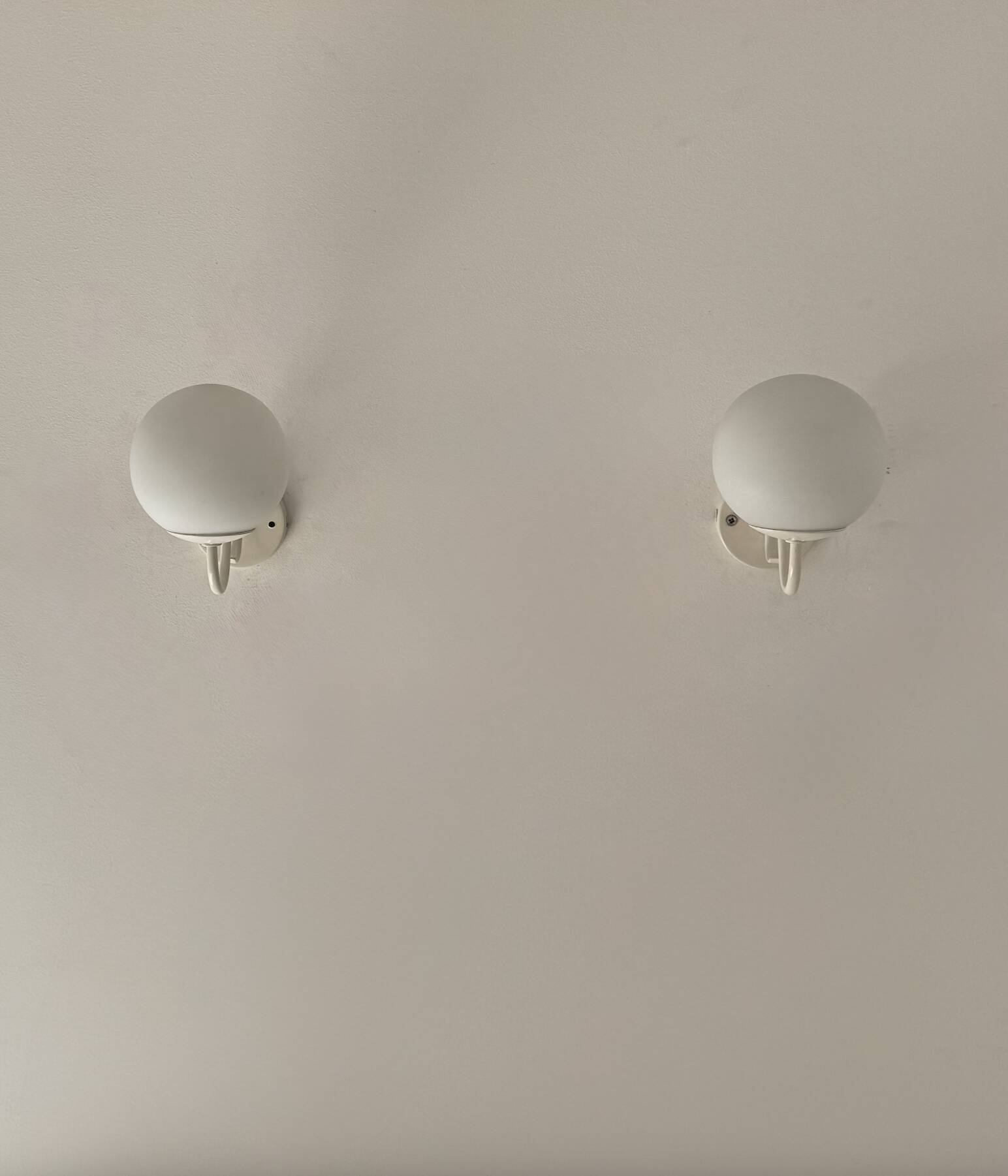Pair of vintage metal and opaline wall lights, France, 1980.