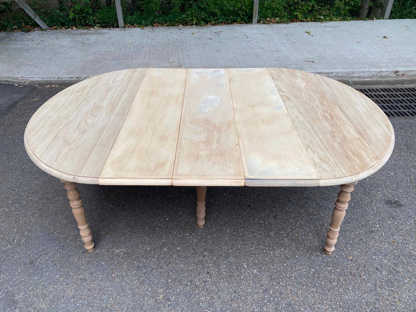 Renovated Louis Philippe round extendable dining table with flaps and 3 extensions.