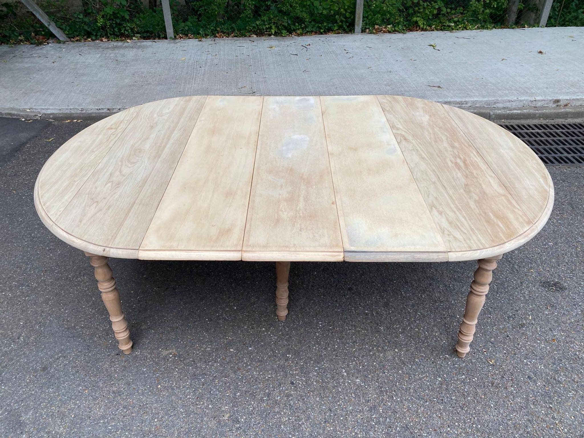 Renovated Louis Philippe round extendable dining table with flaps and 3 extensions.