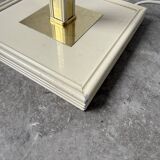 Floor lamp with articulated arm in brass-plated metal