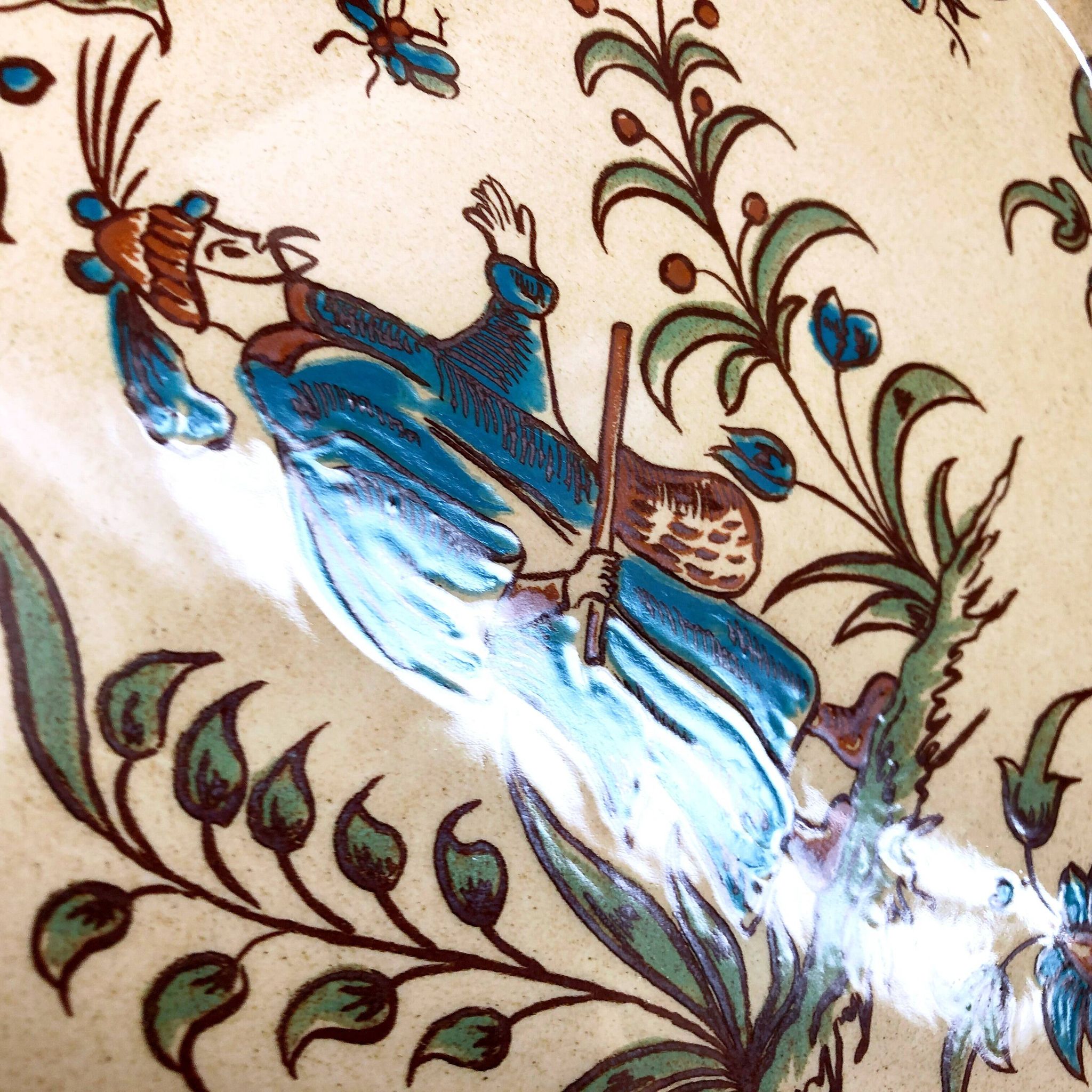 Decorative earthenware plate from Salins France, Moustiers decor, 25.5 cm