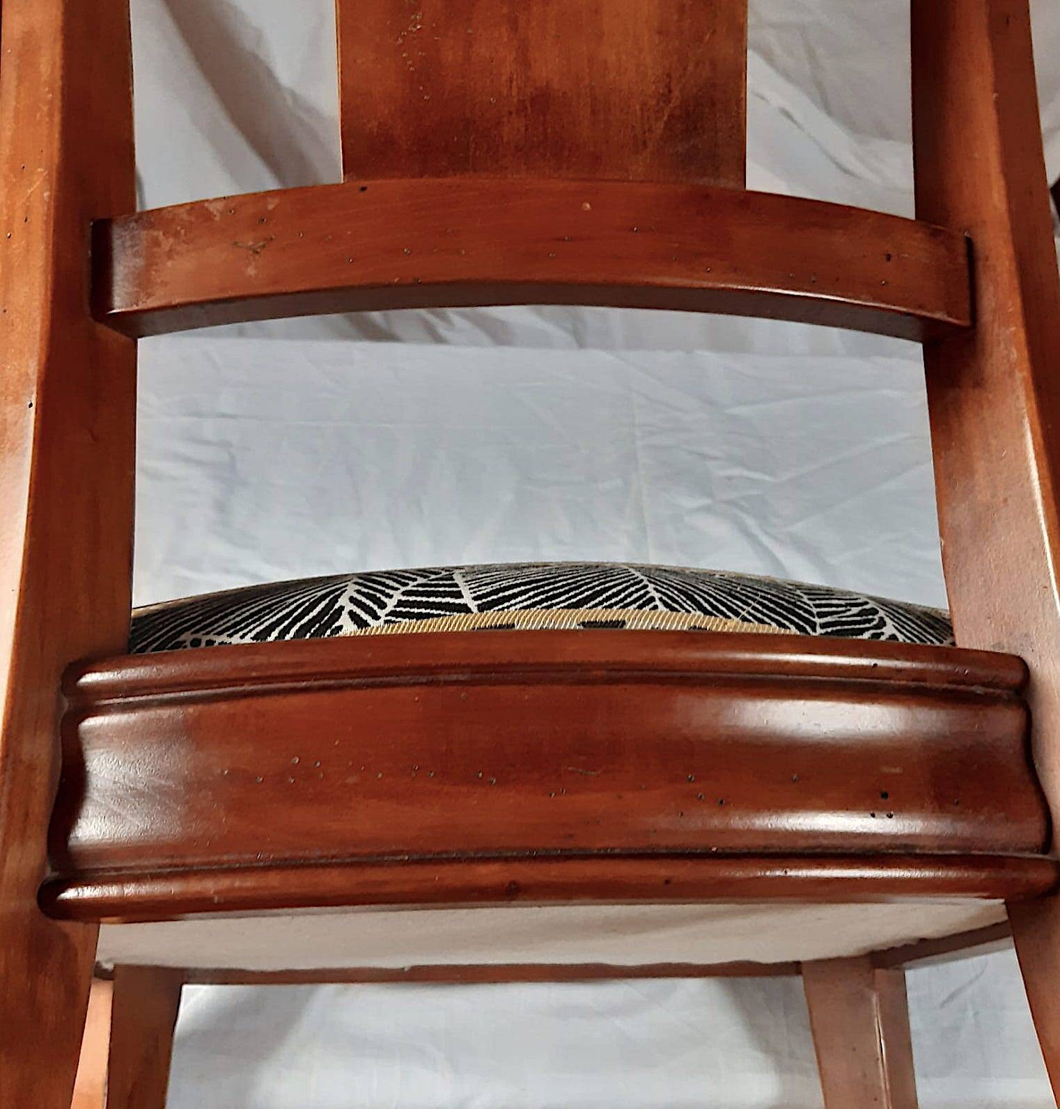 2 varnished solid wood chairs with "ethnic" padding