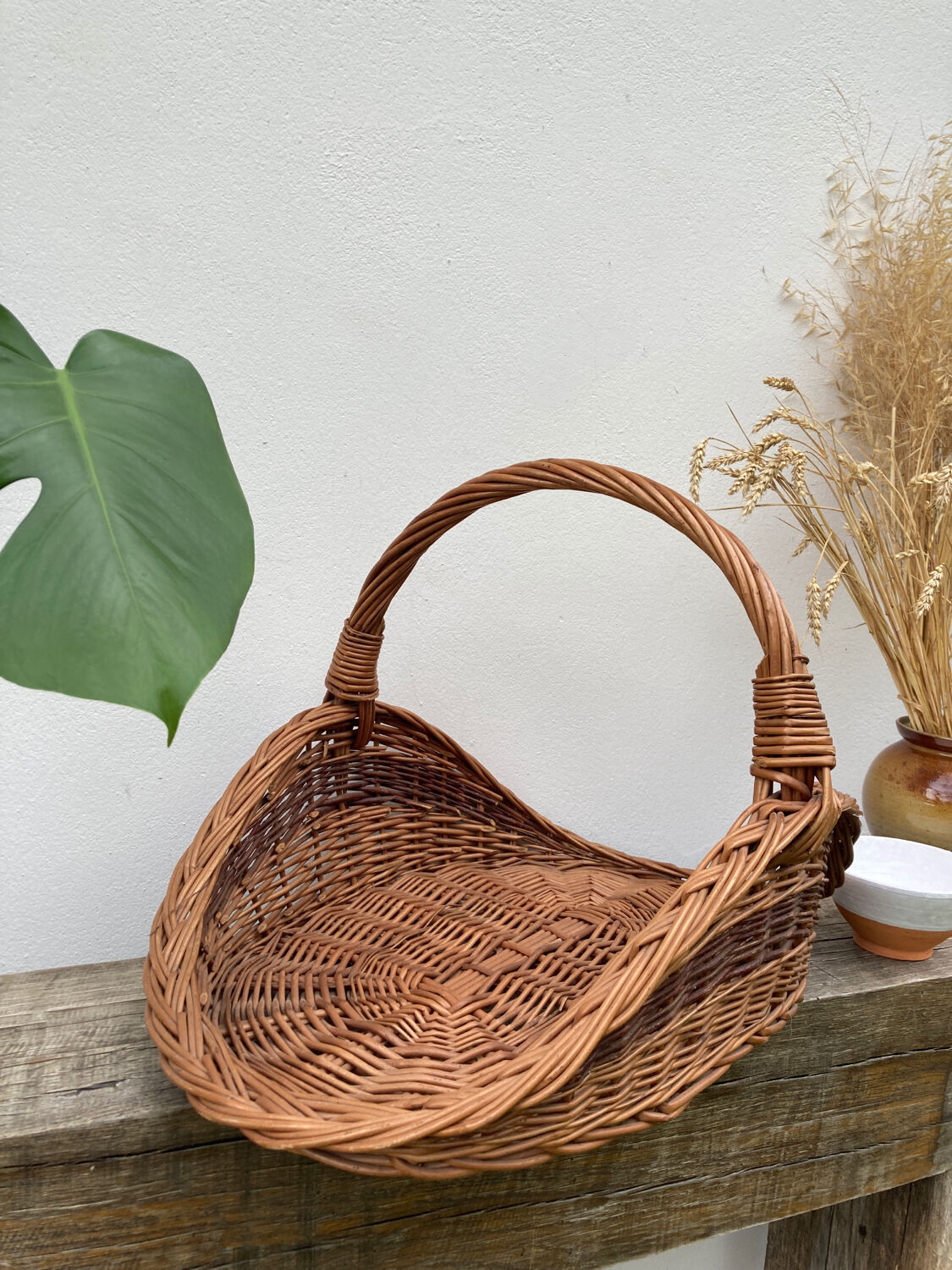 Large old woven wicker log basket