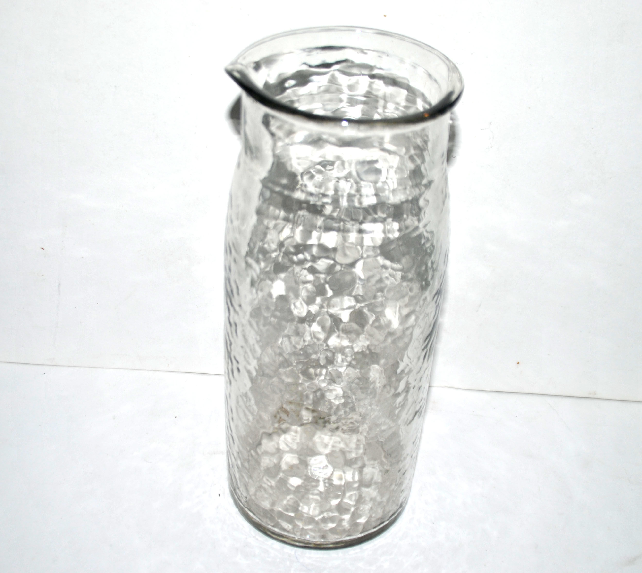 Vintage water pitcher in hammered moulded glass 25cm
