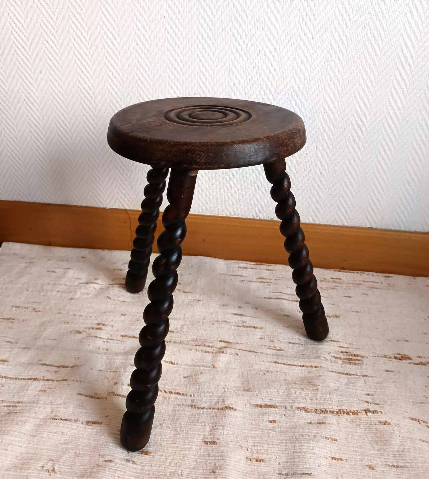 Brutalist tripod stool with twisted legs
