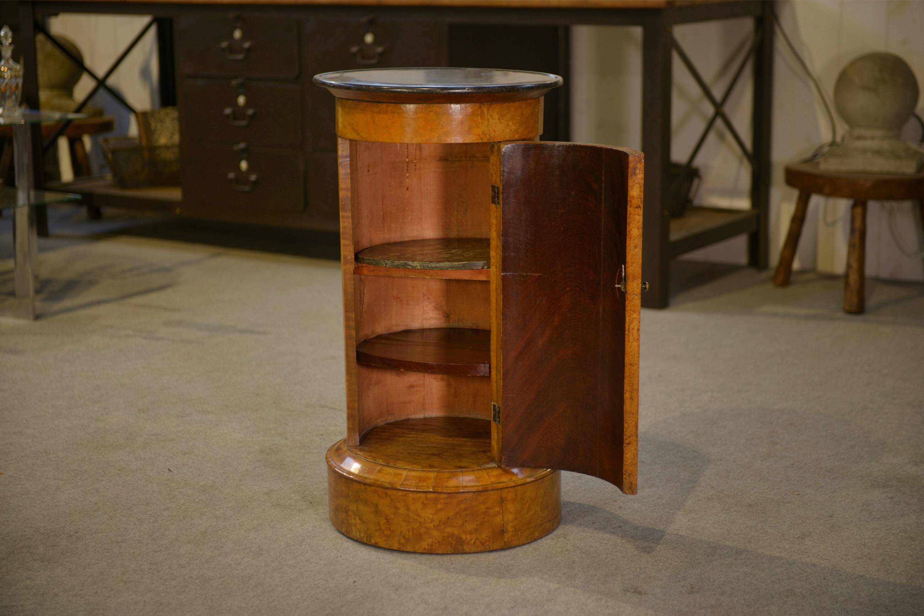 Empire gueridon in mottled maple with a blue stone top, 19th century.