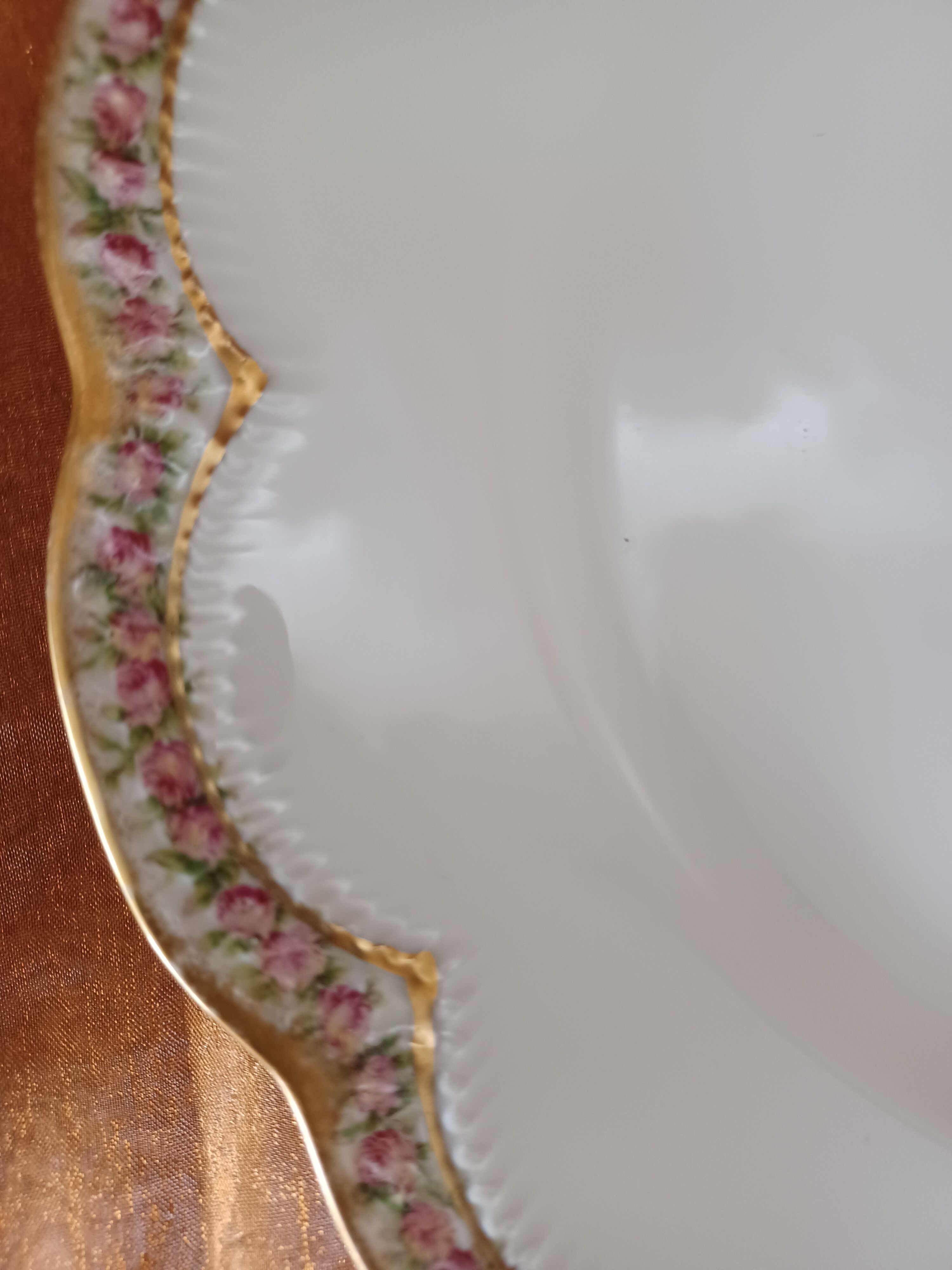 Haviland porcelain plate, contour decorations in floral garland.