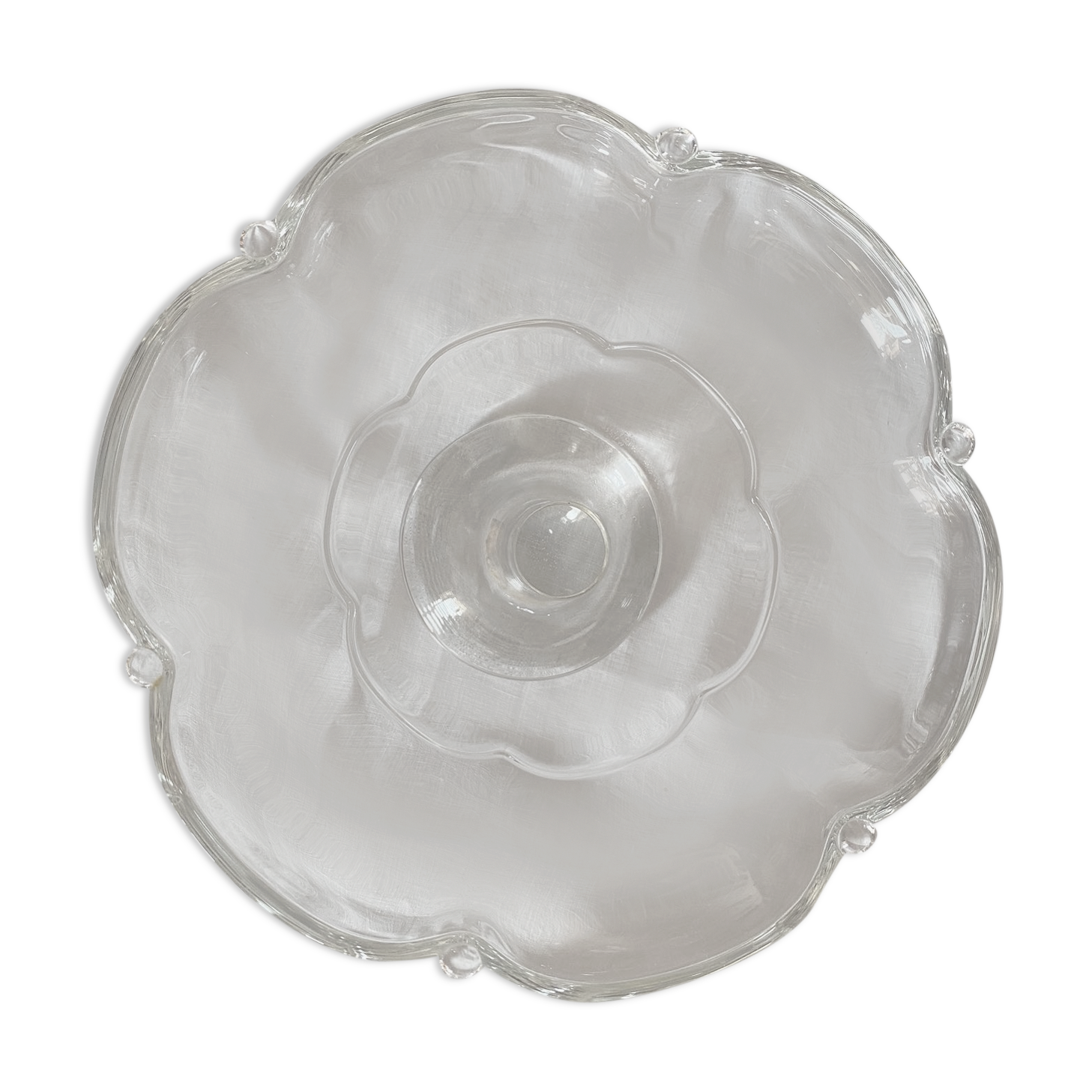 Standing molded glass cup depicting a flower