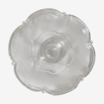 Standing molded glass cup depicting a flower