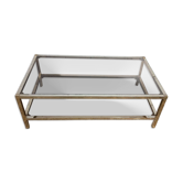 1970s coffee table in brass with a double smoked glass top.