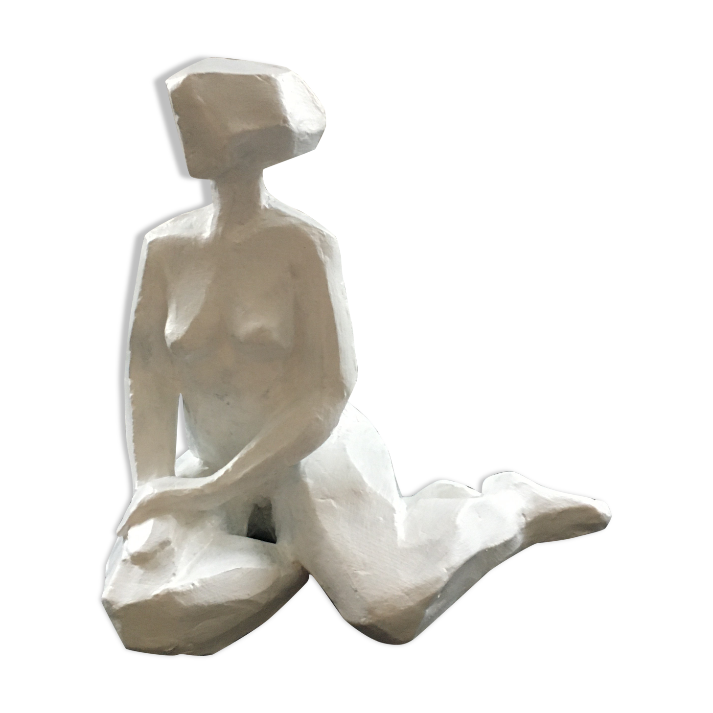 Statuette woman seated in plaster