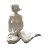 Statuette woman seated in plaster