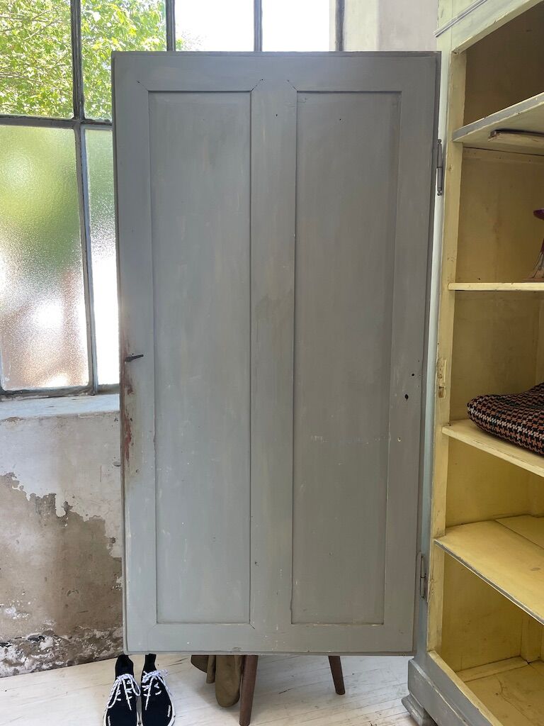 Blue patinated cap cabinet