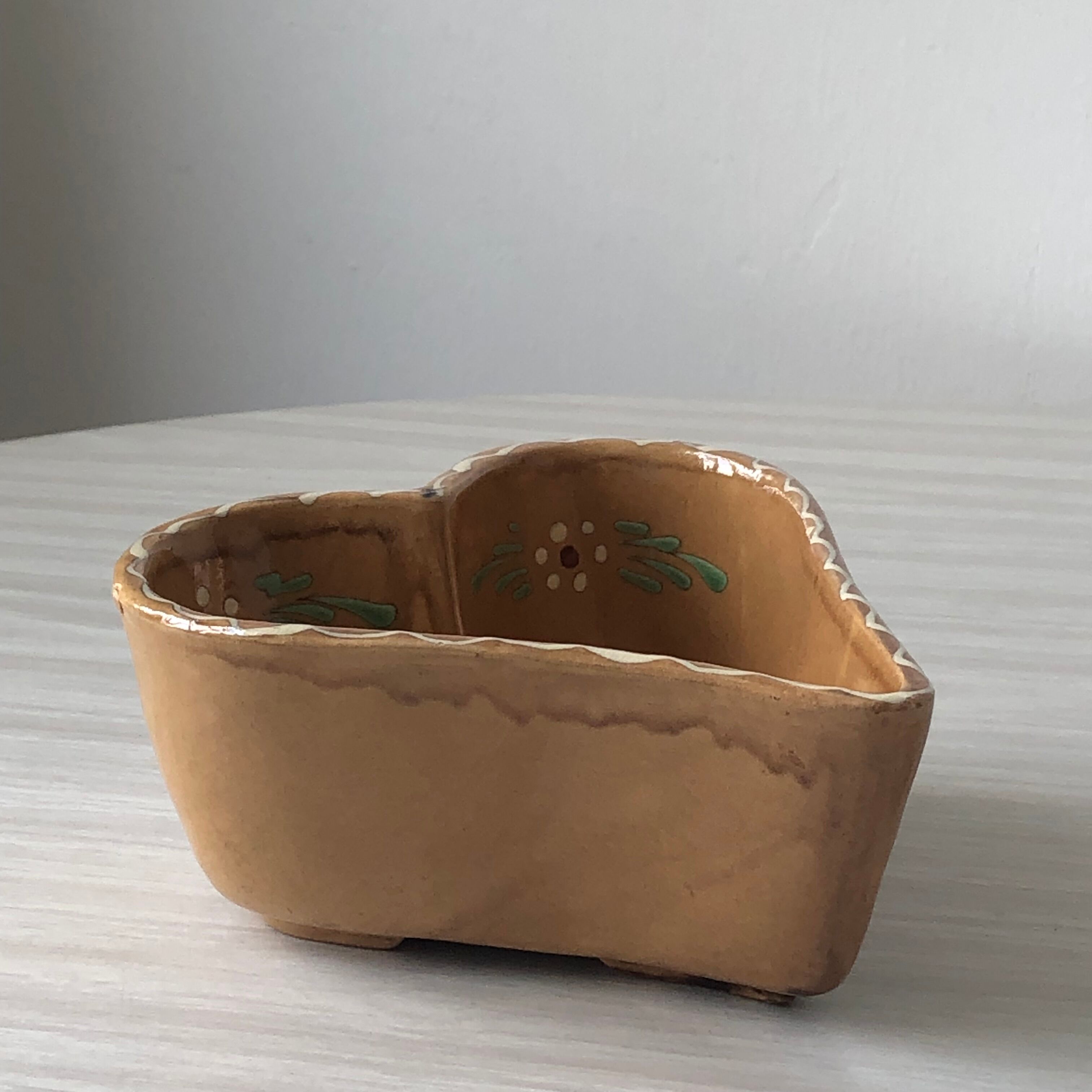 Alsatian decorative dish "heart" with floral motif in glazed terracotta