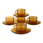 Amber glass coffee service with floral decoration.