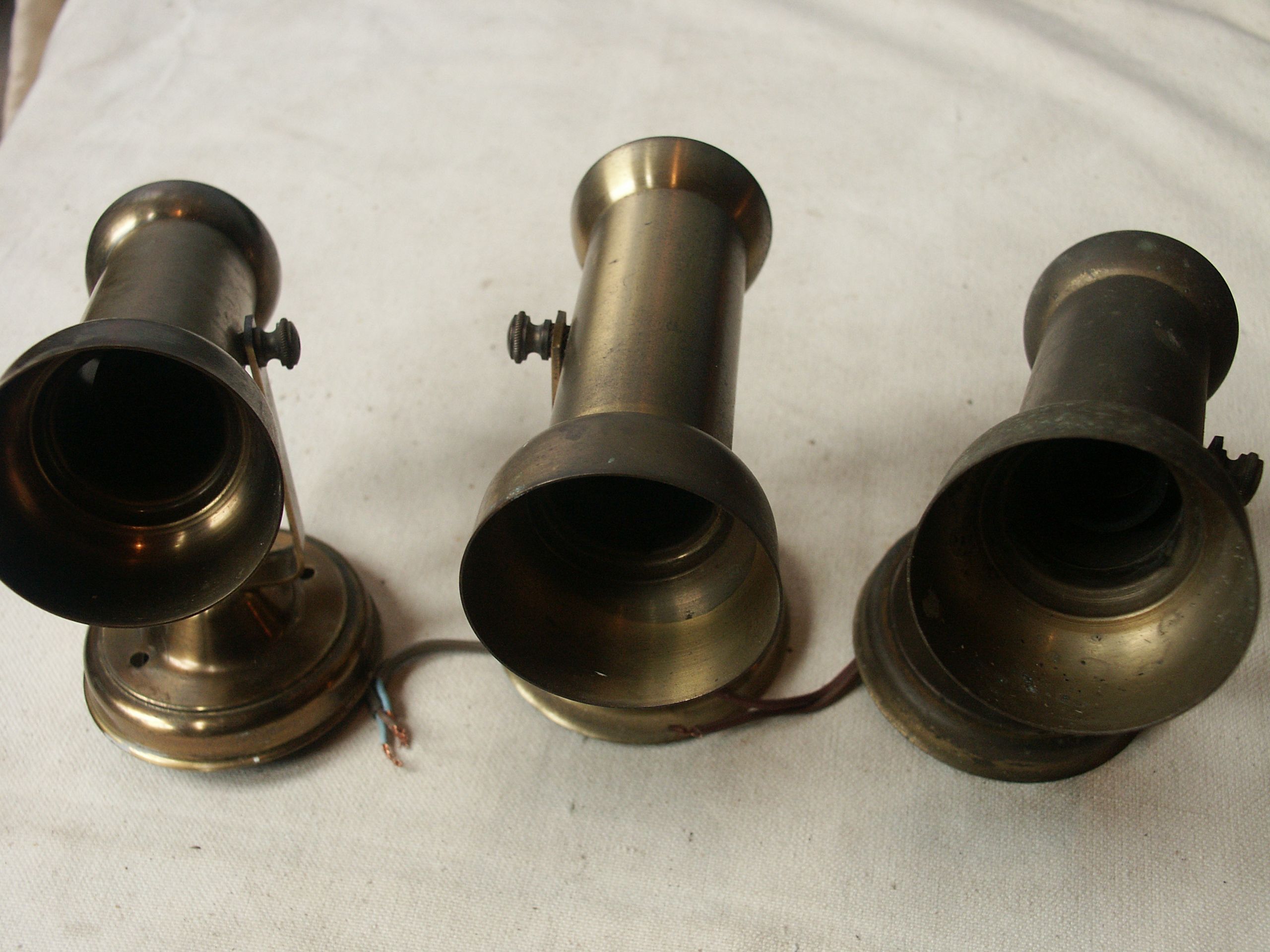 Trio of brass spots year 70