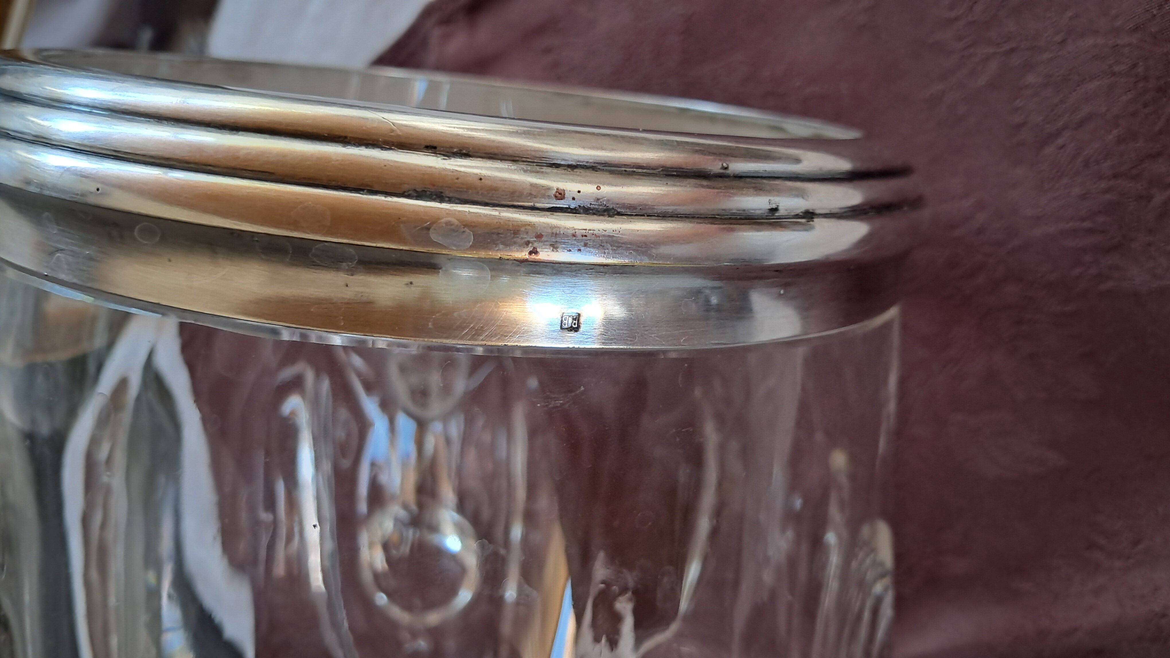 Twisted moulded glass bistro champagne bucket with a silver metal collar.