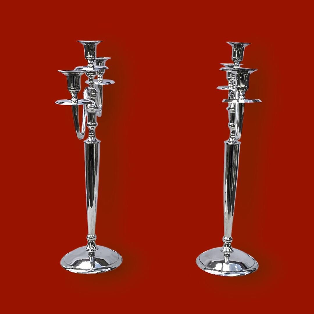 Pair of vintage three-armed chrome metal candlesticks