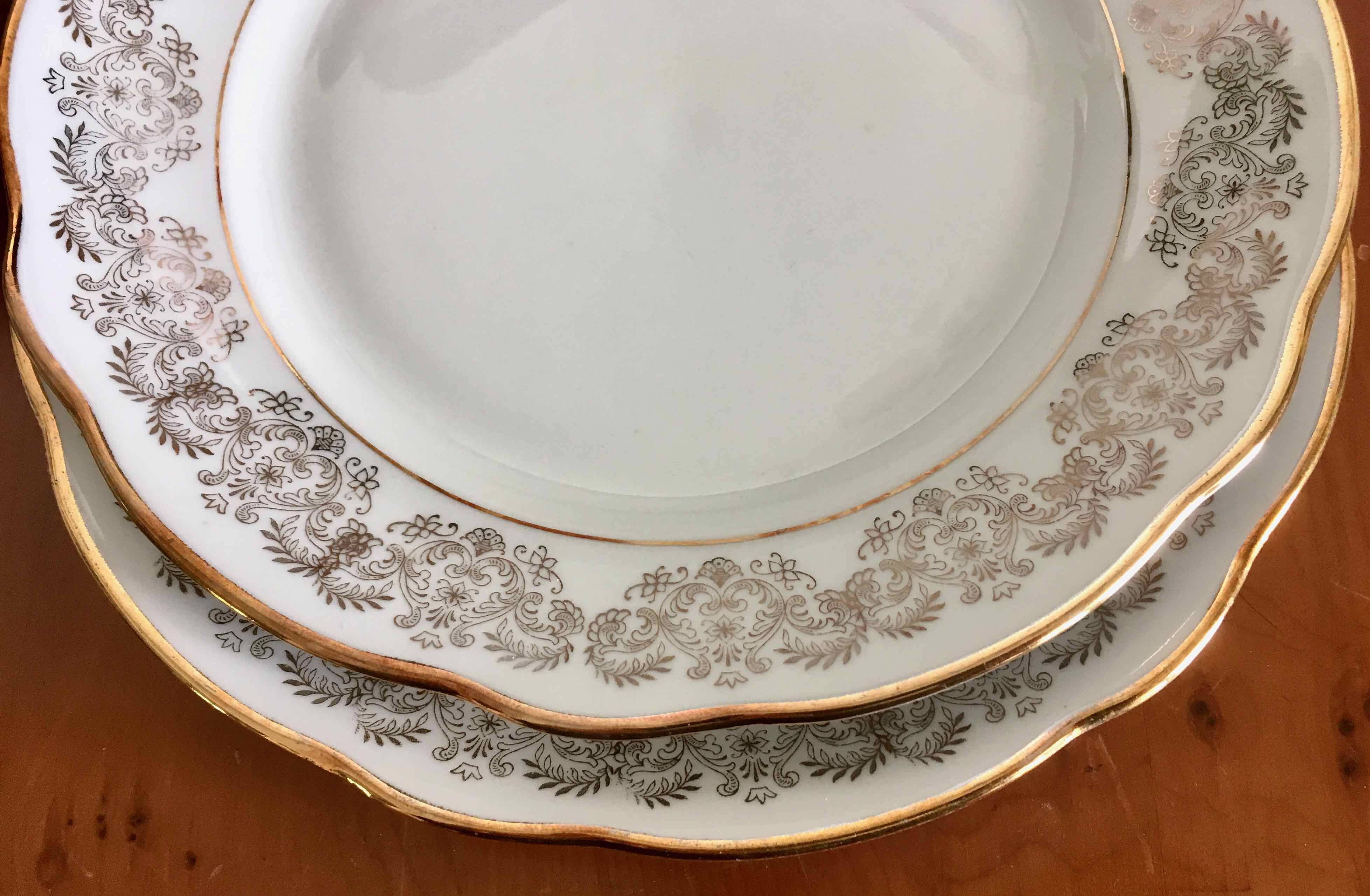 8 white and gold porcelain dessert plates
