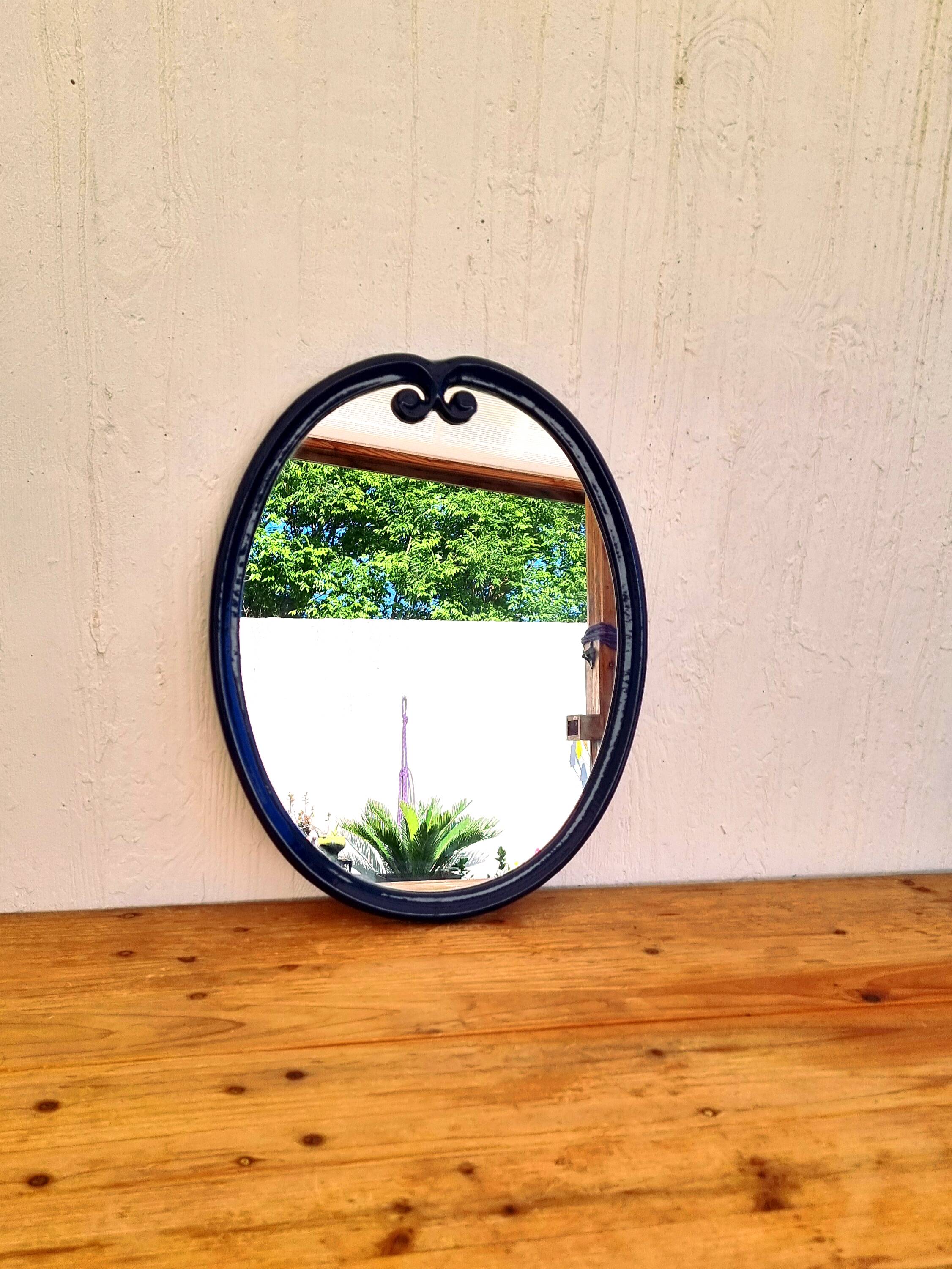 Vintage enameled blue oval mirror