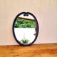 Vintage enameled blue oval mirror