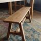 "A frame" bench in solid oak, patinated.