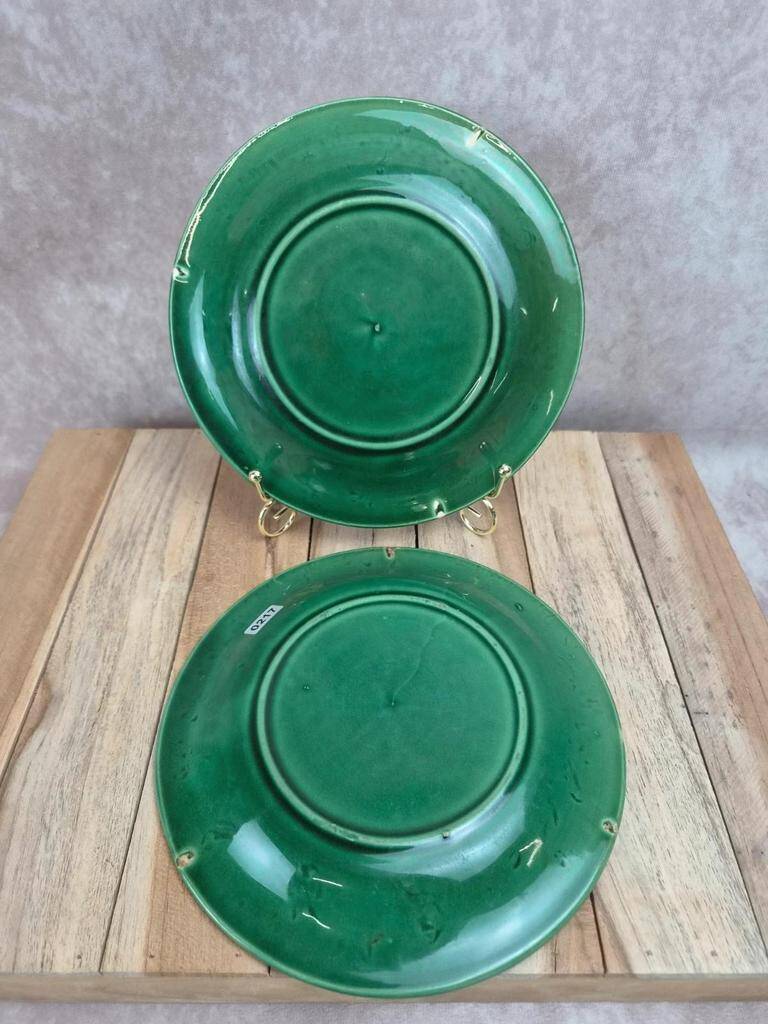 Set of 2 green earthenware dessert plates with vine decoration.