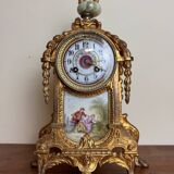 Napoleon III clock in gilded bronze and porcelain plates decorated and painted by hand