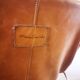 Fauteuil G1 de Pierre Guariche en cuir cognac
