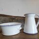 Large pitcher and enameled basin.