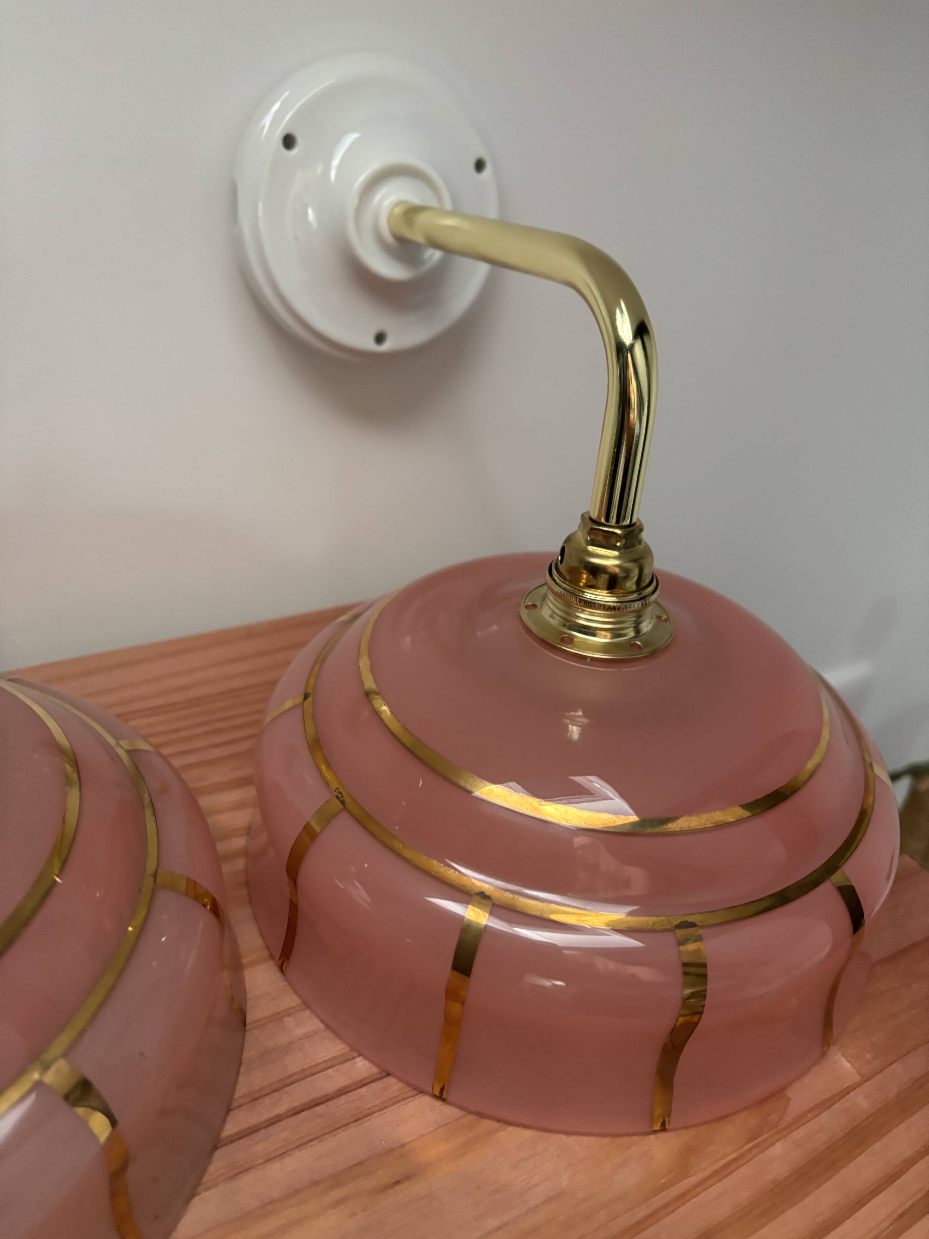 Pair of white ceramic wall lights with pink glass