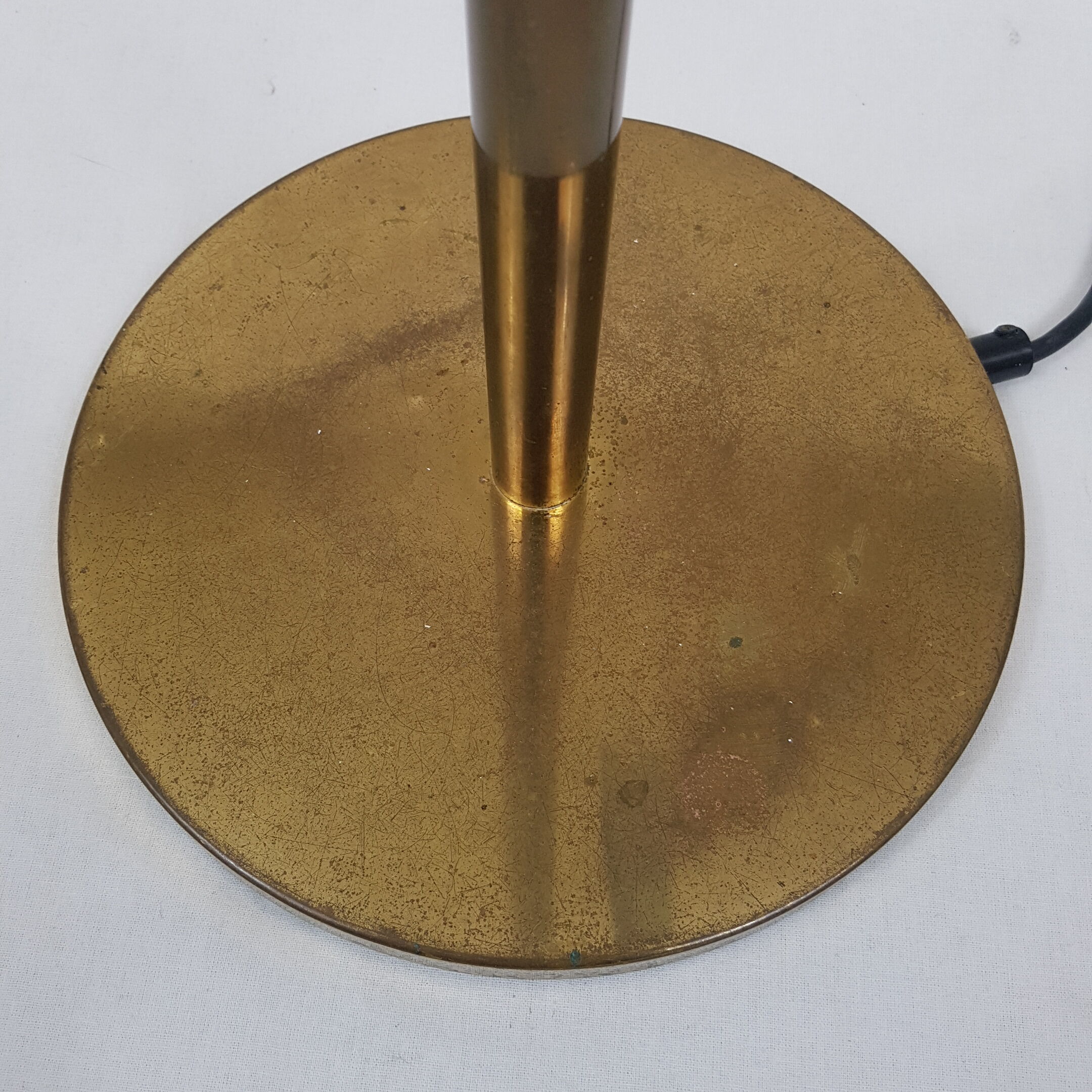 Articulated brass floor lamp