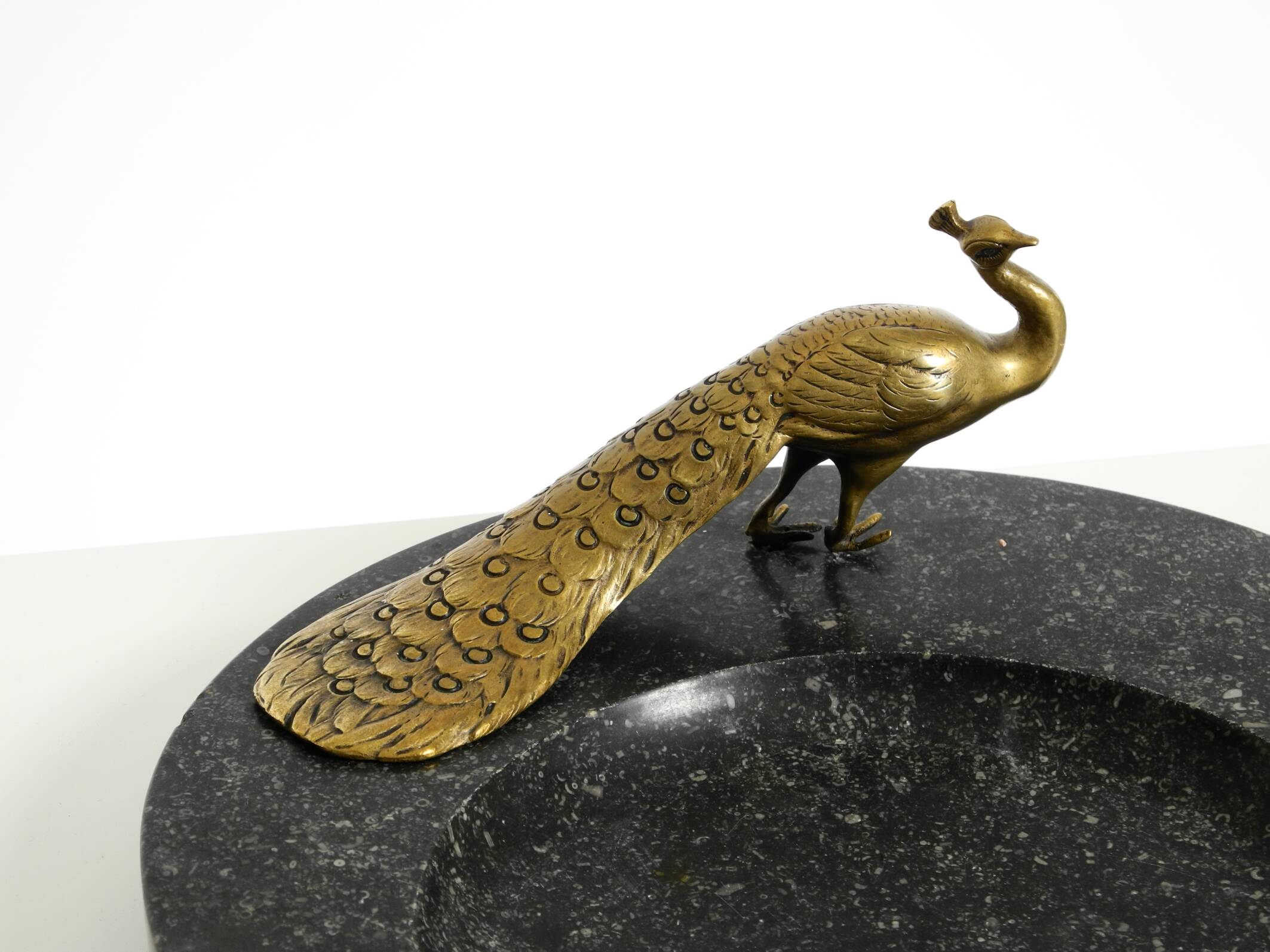 Beautiful, large black granite valet tray featuring a brass peacock, circa