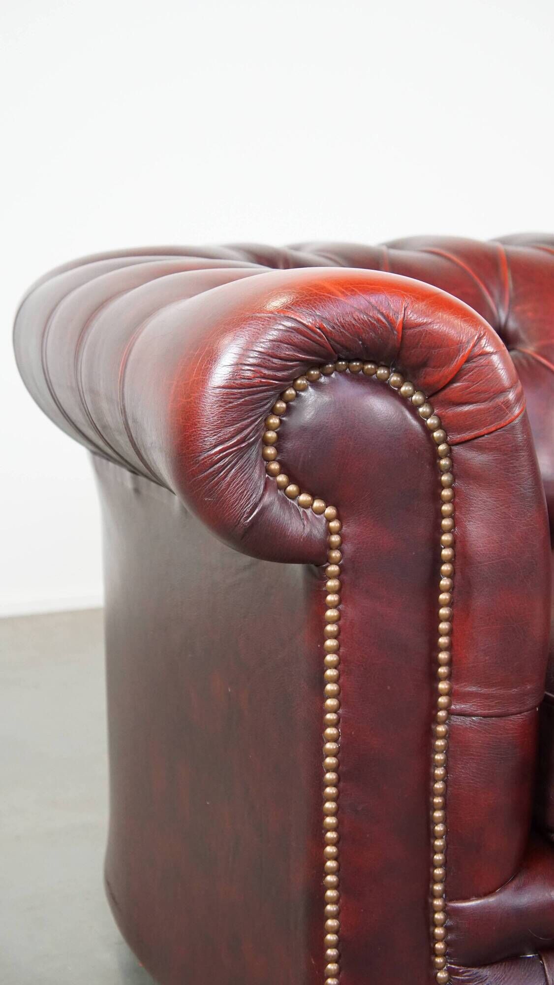 Original English Chesterfield sofa in red cowhide 2 seater