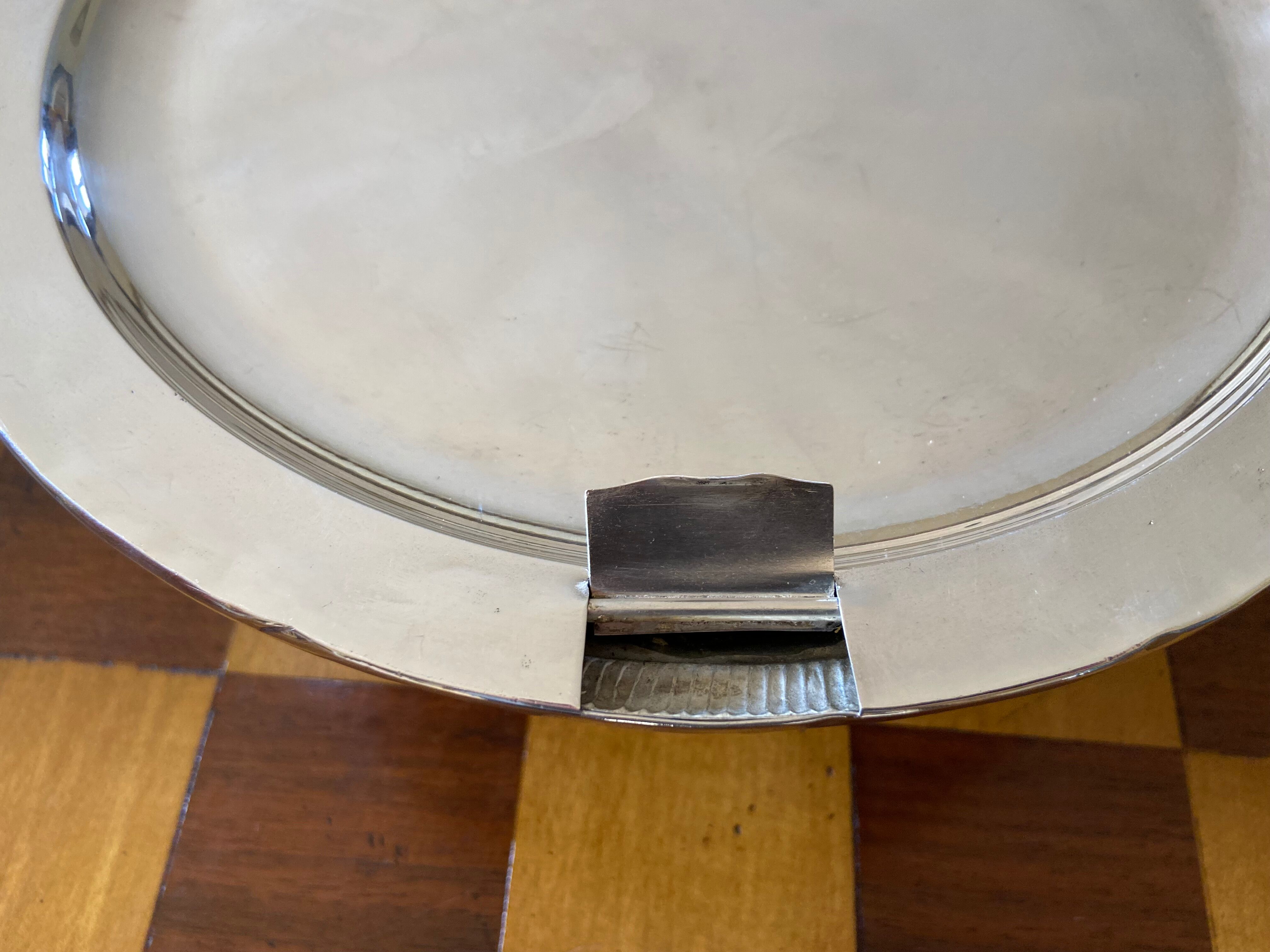 Old silver metal trivet