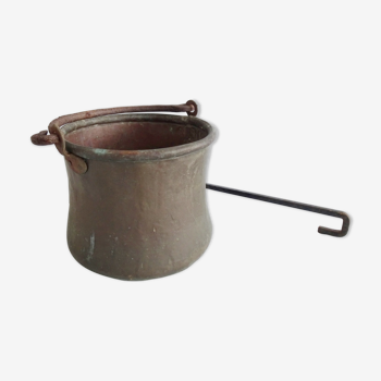 Antique pot with handle and rod from the 19th century