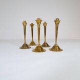 Mid-century set of 5 brass candlesticks by Lars Holmström, Arvika, Sweden.