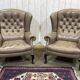Pair of high-backed Chesterfield armchairs with 1 leather footrest
