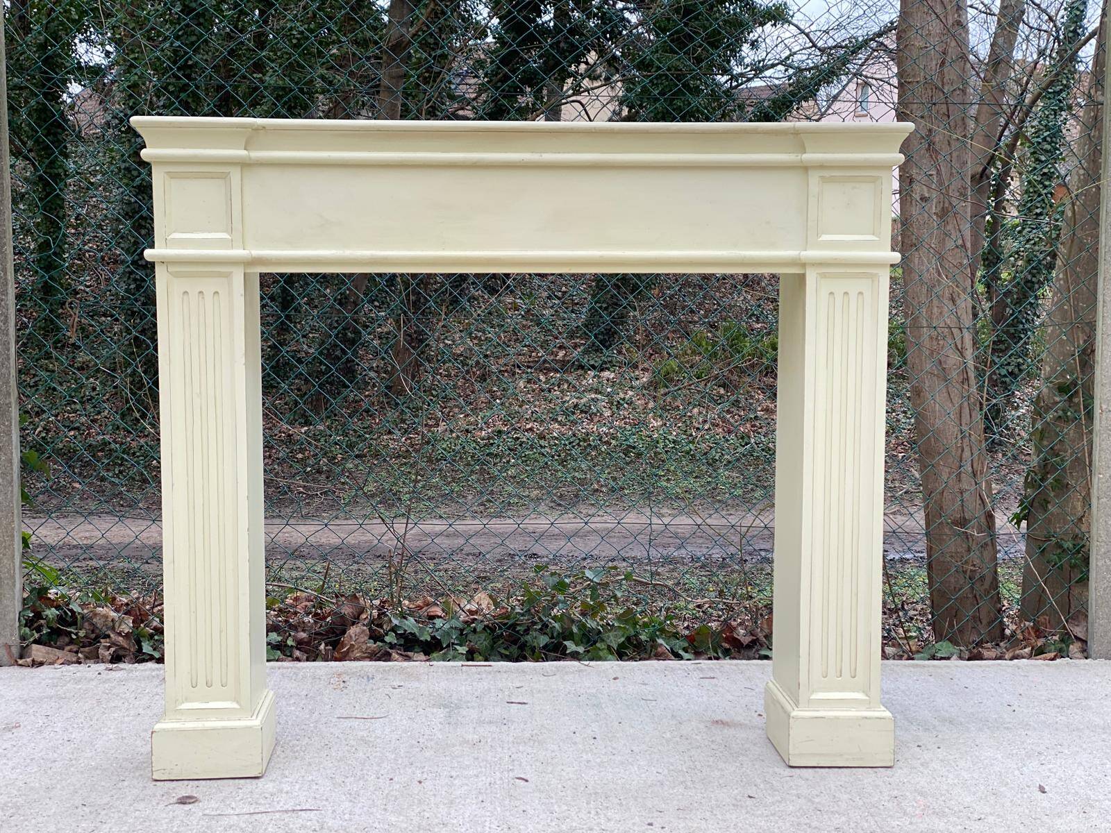 Fireplace surround with beige solid wood mantel
