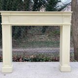 Fireplace surround with beige solid wood mantel