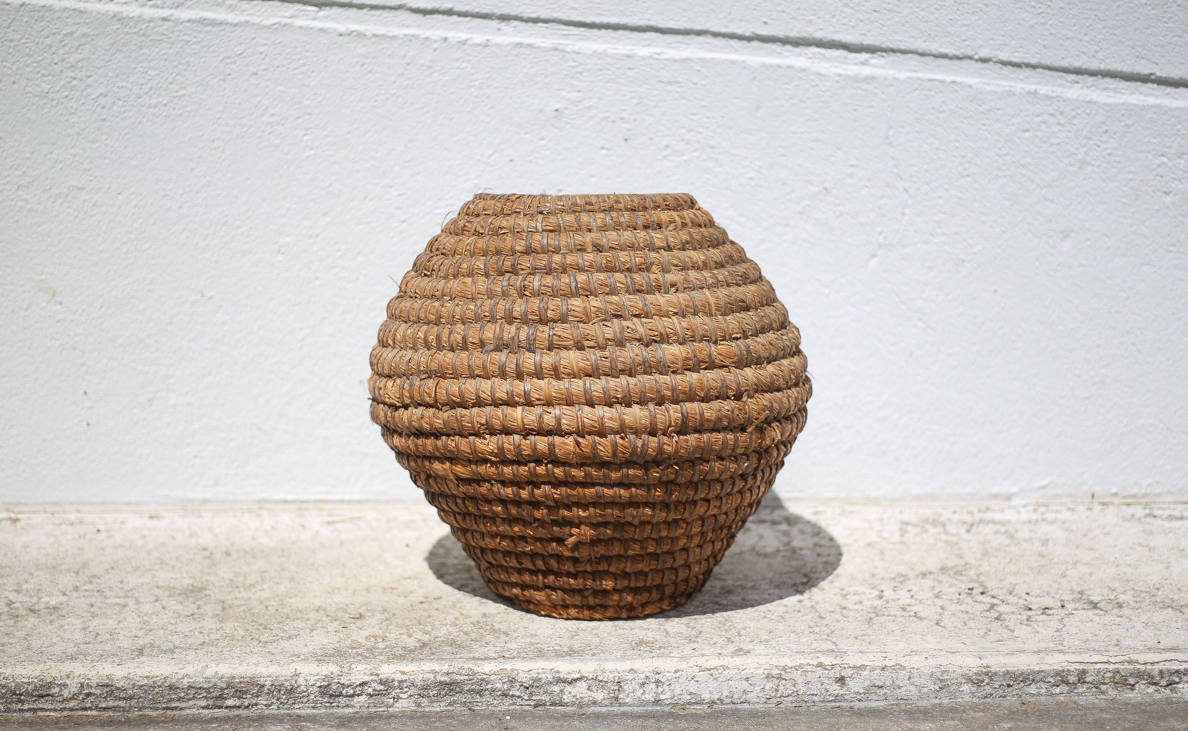Old basket, burgundy straw and bramble, woven basket, interior decoration
