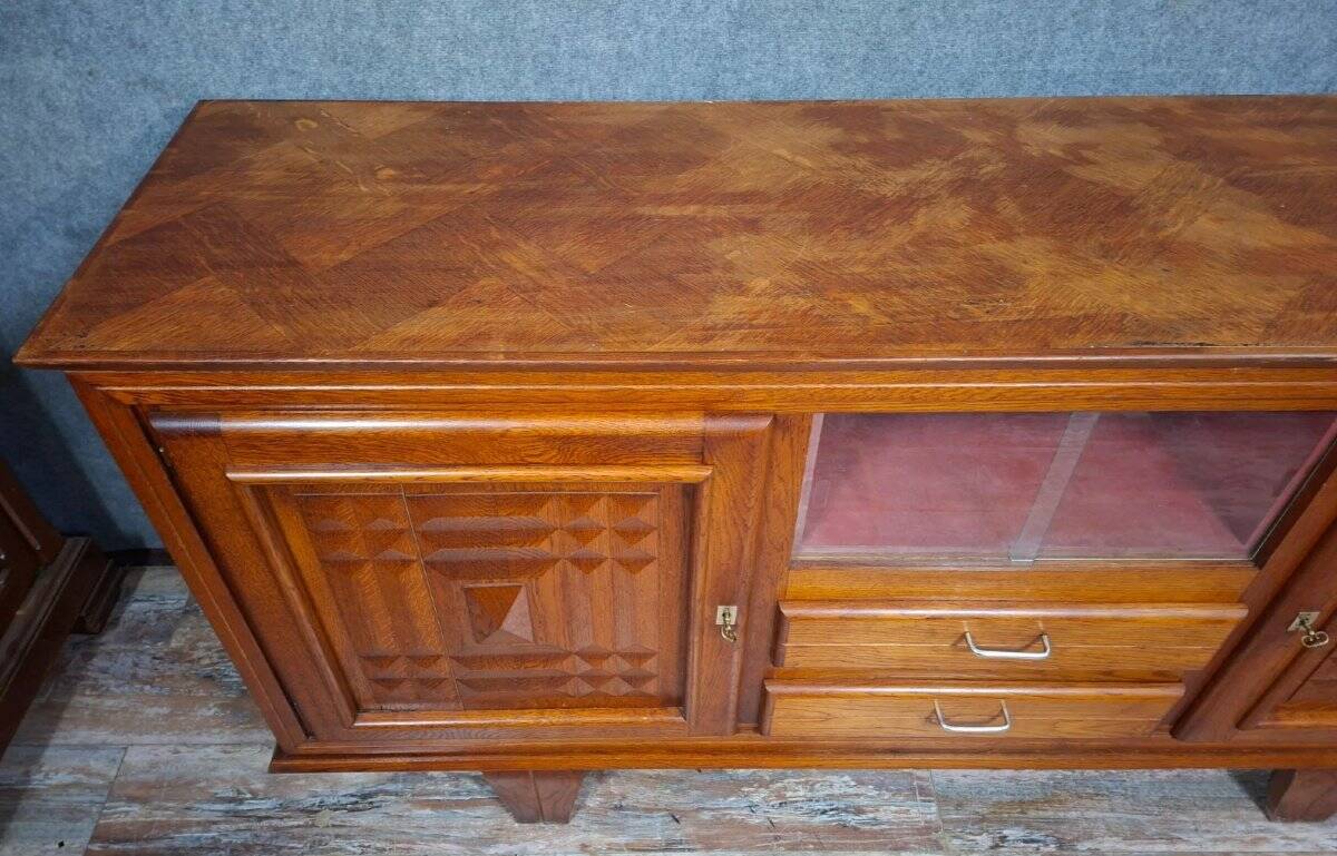 Low buffet in carved oak, Art Deco style, circa 1930.