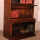 Library says stacking bookcase in oak with 6 elements and a projection.