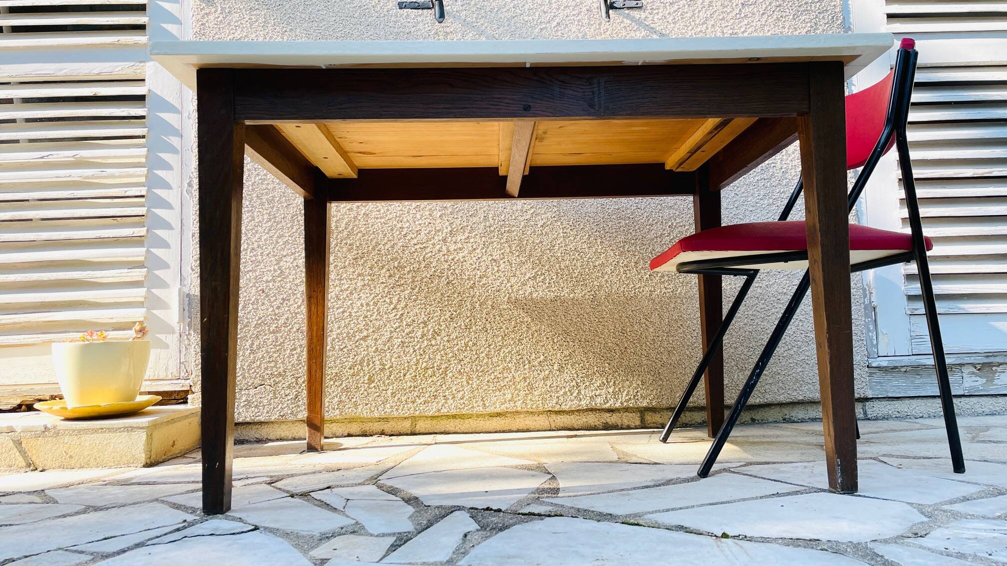 Vintage oak farmhouse table with a white top.