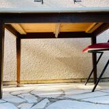 Vintage oak farmhouse table with a white top.