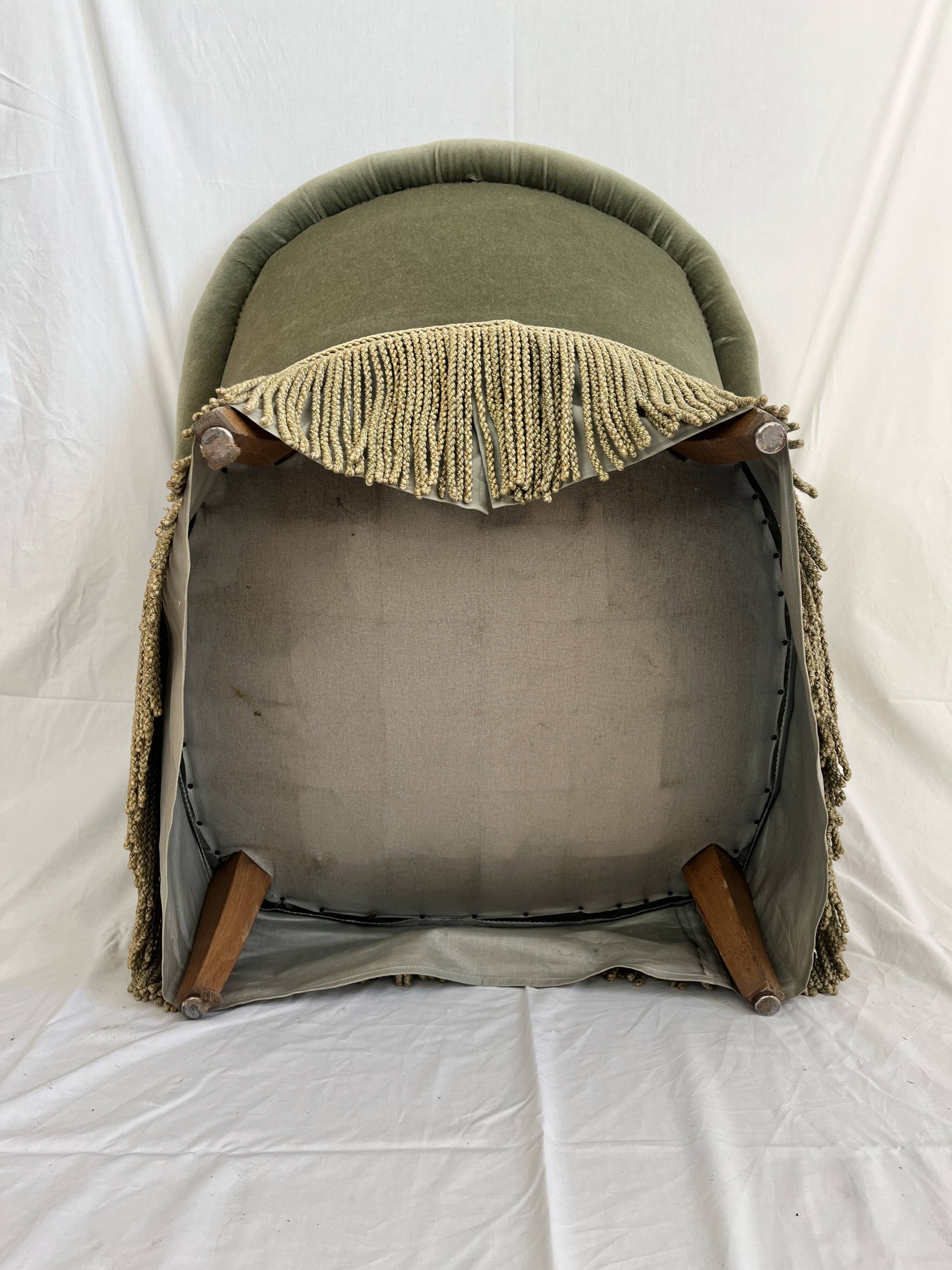 sage green toad armchairs with gold fringe