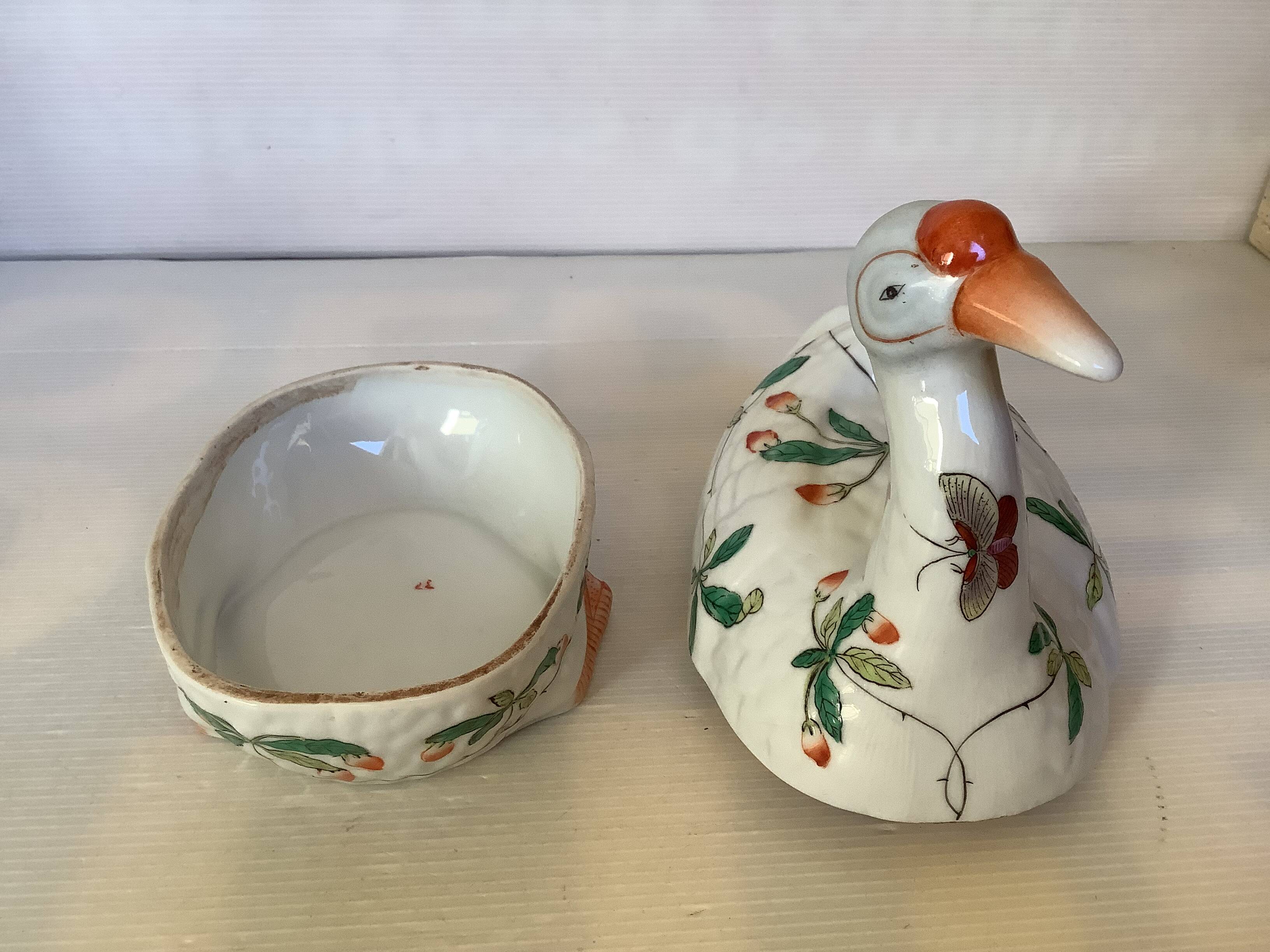 Large bird pocket emptier with butterflies and flowers.